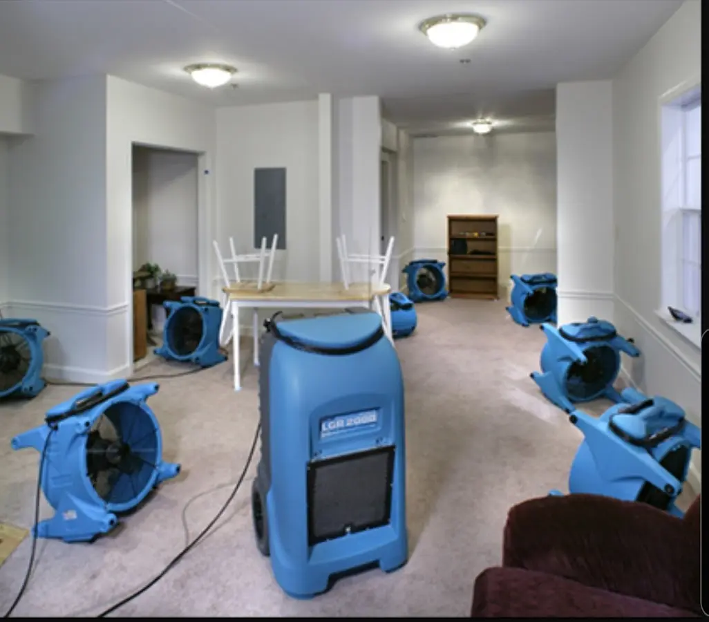 Air movers and dehumidifier setup for Water Damage Restoration in Country Club