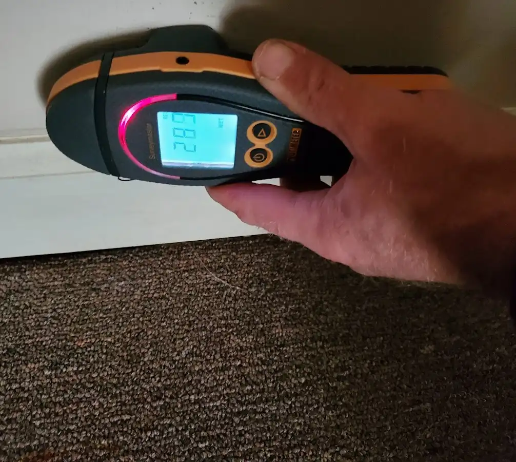 Moisture detection at baseboard during Burst Pipe Cleanup in Country Club
